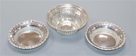 A pair of late Victorian pierced silver nut dishes, William Hutton & Sons, Birmingham, 1899 and one other silver dish.